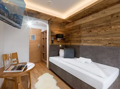 Ein Bett oder Betten in einem Zimmer der Unterkunft Tennenwirt Guesthouse - Adults only