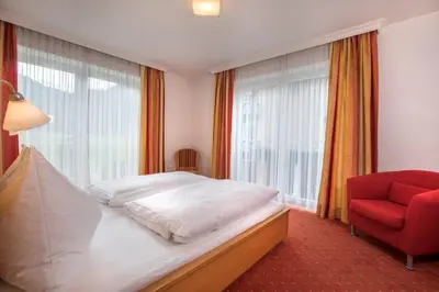 Ein Bett oder Betten in einem Zimmer der Unterkunft Garni Rösslhof