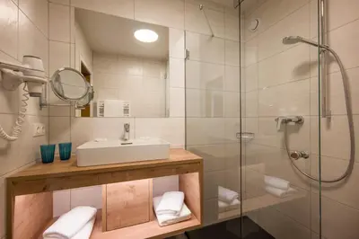 Ein Badezimmer in der Unterkunft Post Appartements