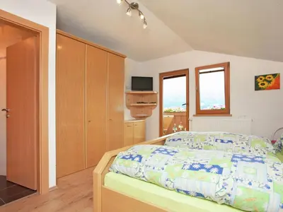 Ein Bett oder Betten in einem Zimmer der Unterkunft Apartment in Hollersbach near Ski Lift