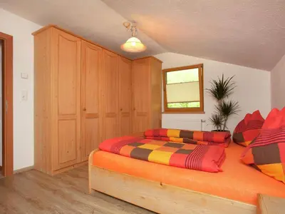 Ein Bett oder Betten in einem Zimmer der Unterkunft Apartment in Hollersbach near Ski Lift
