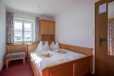 Ein Bett oder Betten in einem Zimmer der Unterkunft Pension Klausnerhof