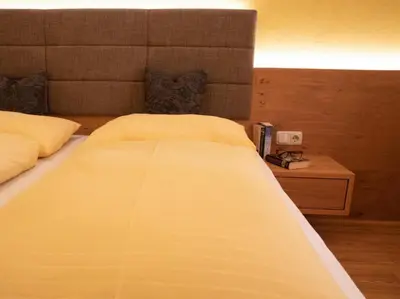 Ein Bett oder Betten in einem Zimmer der Unterkunft Hotel Königsleiten Vital Alpin