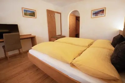 Ein Bett oder Betten in einem Zimmer der Unterkunft Hotel Königsleiten Vital Alpin