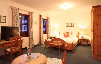 Ein Bett oder Betten in einem Zimmer der Unterkunft Hotel Unterbrunn Apartments & Gästehaus