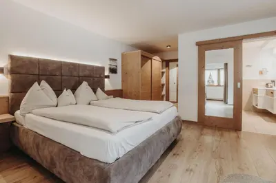 Ein Bett oder Betten in einem Zimmer der Unterkunft Habachklause Familien Bauernhof Resort