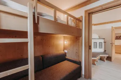 Ein Bett oder Betten in einem Zimmer der Unterkunft Habachklause Familien Bauernhof Resort