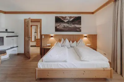 Ein Bett oder Betten in einem Zimmer der Unterkunft Habachklause Familien Bauernhof Resort
