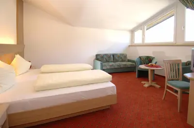 Ein Sitzbereich in der Unterkunft Hotel Bräurup