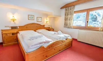 Ein Bett oder Betten in einem Zimmer der Unterkunft Hotel Wechselberger by Alpeffect Hotels