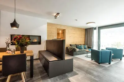 Ein Sitzbereich in der Unterkunft Mountain Chalet Kirchberg by Apartment Managers