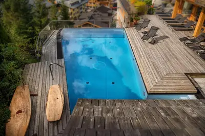 Der Swimmingpool an oder in der Nähe von Alpin Juwel - Bio und Lifestylehotel