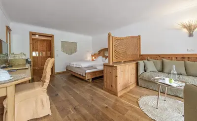 Ein Bett oder Betten in einem Zimmer der Unterkunft Alpin Juwel - Bio und Lifestylehotel