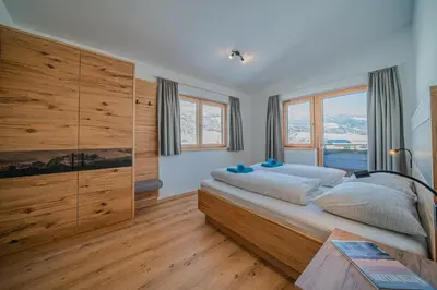 Ein Bett oder Betten in einem Zimmer der Unterkunft Appartements Andrea Cäciel - Alpline Appartements KG