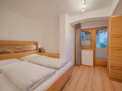 Ein Bett oder Betten in einem Zimmer der Unterkunft Appartements Andrea Cäciel - Alpline Appartements KG