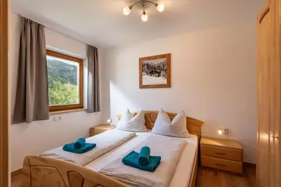 Ein Bett oder Betten in einem Zimmer der Unterkunft Appartements Andrea Cäciel - Alpline Appartements KG