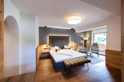 Ein Bett oder Betten in einem Zimmer der Unterkunft Alpenland Gerlos - Hotel & Breakfast