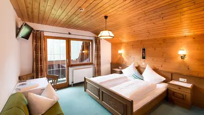 Ein Bett oder Betten in einem Zimmer der Unterkunft Pension Waidmannsruh