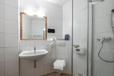 Ein Badezimmer in der Unterkunft Hotel Austria Wildschönau