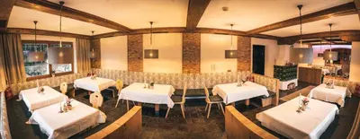 Ein Restaurant oder anderes Speiselokal in der Unterkunft Panoramahotel Schwendbergerhof