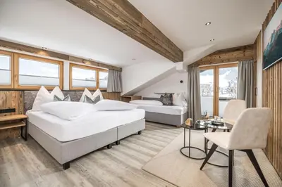 Ein Bett oder Betten in einem Zimmer der Unterkunft Pension Rofan