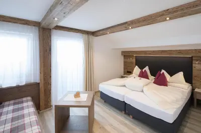 Ein Bett oder Betten in einem Zimmer der Unterkunft Pension Rofan