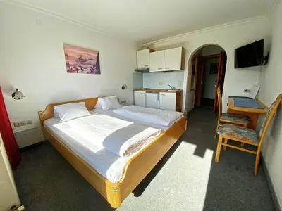 Ein Bett oder Betten in einem Zimmer der Unterkunft Pension Franglhof by Apartment Managers