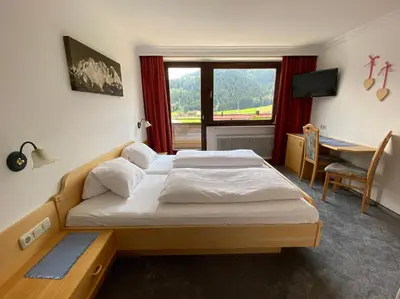 Ein Bett oder Betten in einem Zimmer der Unterkunft Pension Franglhof by Apartment Managers