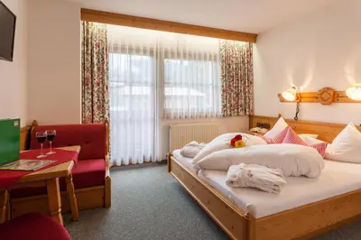 Ein Bett oder Betten in einem Zimmer der Unterkunft Hotel Garni Hanslerhof 