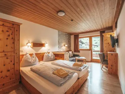 Ein Bett oder Betten in einem Zimmer der Unterkunft Hotel Mitterhof