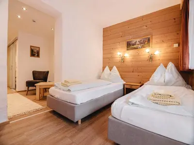 Ein Bett oder Betten in einem Zimmer der Unterkunft Hotel Mitterhof