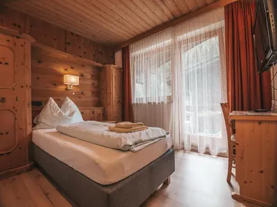 Ein Bett oder Betten in einem Zimmer der Unterkunft Hotel Mitterhof