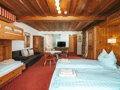 Ein Bett oder Betten in einem Zimmer der Unterkunft Hotel Mitterhof
