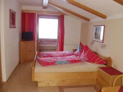 Ein Bett oder Betten in einem Zimmer der Unterkunft Ferienwohnung Hörbiger