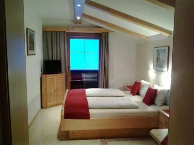 Ein Bett oder Betten in einem Zimmer der Unterkunft Ferienwohnung Hörbiger