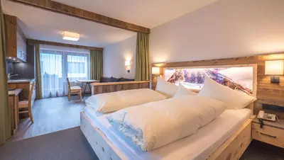 Ein Bett oder Betten in einem Zimmer der Unterkunft Hotel & Apart Central