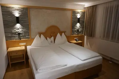 Ein Bett oder Betten in einem Zimmer der Unterkunft Hotel Eder