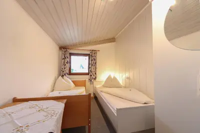 Ein Bett oder Betten in einem Zimmer der Unterkunft Pension Hauser