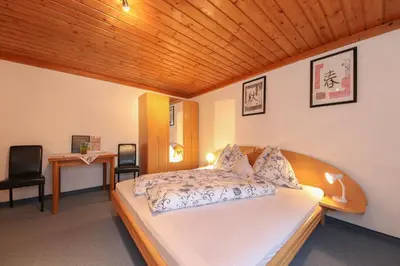 Ein Bett oder Betten in einem Zimmer der Unterkunft Pension Hauser