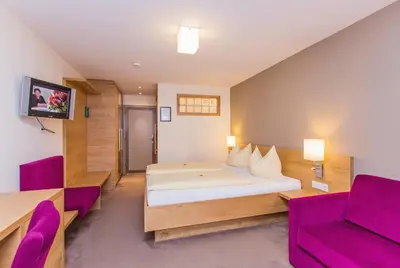 Ein Bett oder Betten in einem Zimmer der Unterkunft Hotel Bacher Asitzstubn