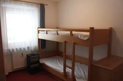Ein Bett oder Betten in einem Zimmer der Unterkunft Ferienwohnungen am Dorfplatz