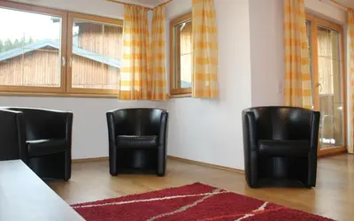 Ein Sitzbereich in der Unterkunft Stöcklgut Ferienhaus