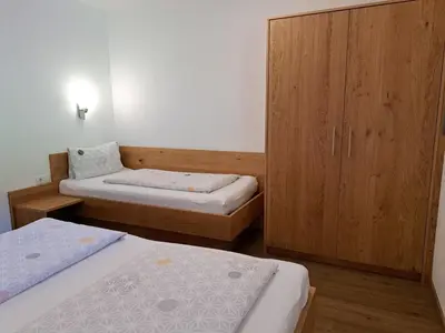Ein Bett oder Betten in einem Zimmer der Unterkunft Apartment Anton-2 by Interhome