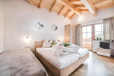 Ein Bett oder Betten in einem Zimmer der Unterkunft Apart Söllbacherhof