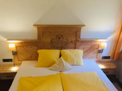 Ein Bett oder Betten in einem Zimmer der Unterkunft Aparthaus Hubertus