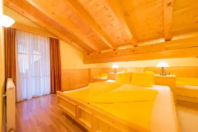 Ein Bett oder Betten in einem Zimmer der Unterkunft Aparthaus Sonnenhof