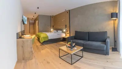 Ein Bett oder Betten in einem Zimmer der Unterkunft KOSIS Sports Lifestyle Hotel