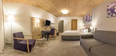 Ein Bett oder Betten in einem Zimmer der Unterkunft KOSIS Sports Lifestyle Hotel
