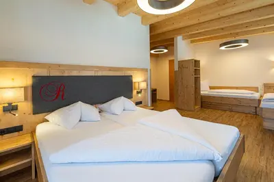 Ein Bett oder Betten in einem Zimmer der Unterkunft Hotel Garni Romantik