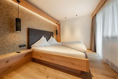 Ein Bett oder Betten in einem Zimmer der Unterkunft Kräuterhotel Hochzillertal